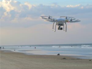 Drone flies over ocean